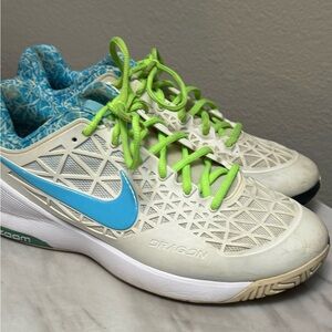 Nike Zoom Women's Dragon Cage 2 tennis shoes in white with a blue swoosh